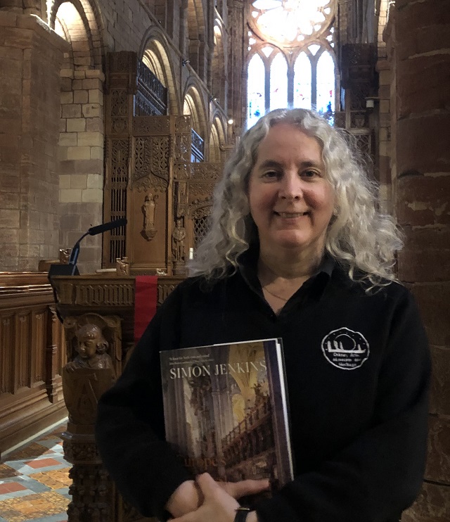 The Council's Cathedral Custodian and Visitor Services Officer, Fran Hollinrake, with Simon Jenkins' book.