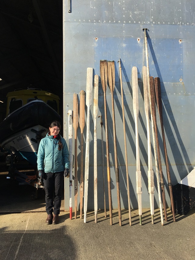 Orla Stevens with oars from Orkney Historic Boat Society