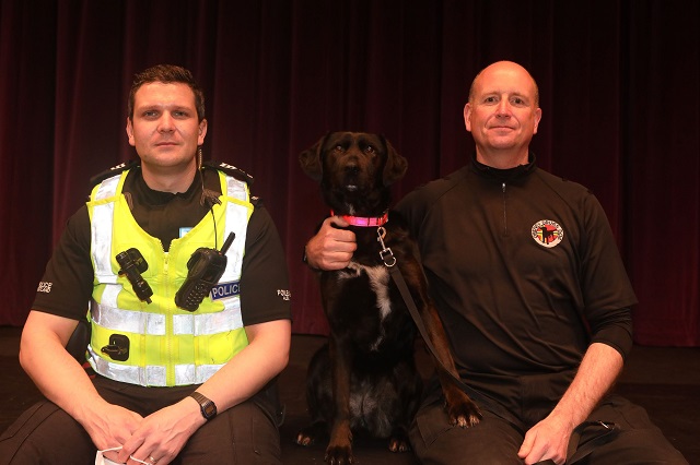 Orkney Drugs Dog handler Kevin Moar and Police Scotland Sergeant Simon Hay - with Orkney Drugs Dog Zoe.