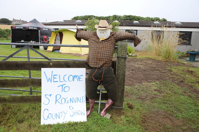 Image of a scarecrow welcoming visitors to the 2021 Peedie County Show at St Rognvalds.