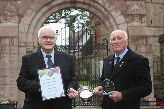 Tom Rendall (left) Chair of the Kirkwall and St Ola Community Council and President of the RBL Kirkwall branch, Eddy Ross (right), with the certificate, cup and trophy marking the accolade of Best Kept War Memorial 2023 (in Community Without Gardens' category)..