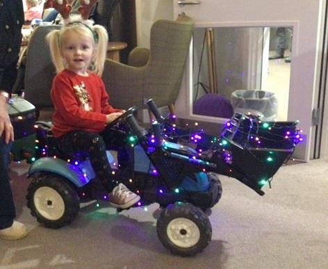 (Photo) One of many bairns who lit up three of Orkney's care homes in a series of Bairns Tractor Runs