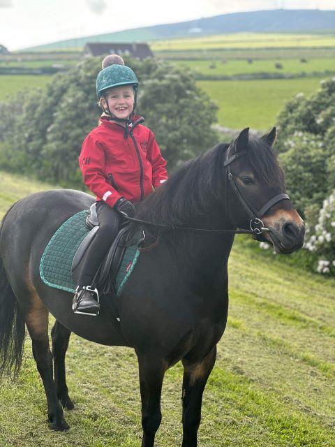 Callie riding her pony Teddy  as part of the Dead  Safe horse road safety campaign
