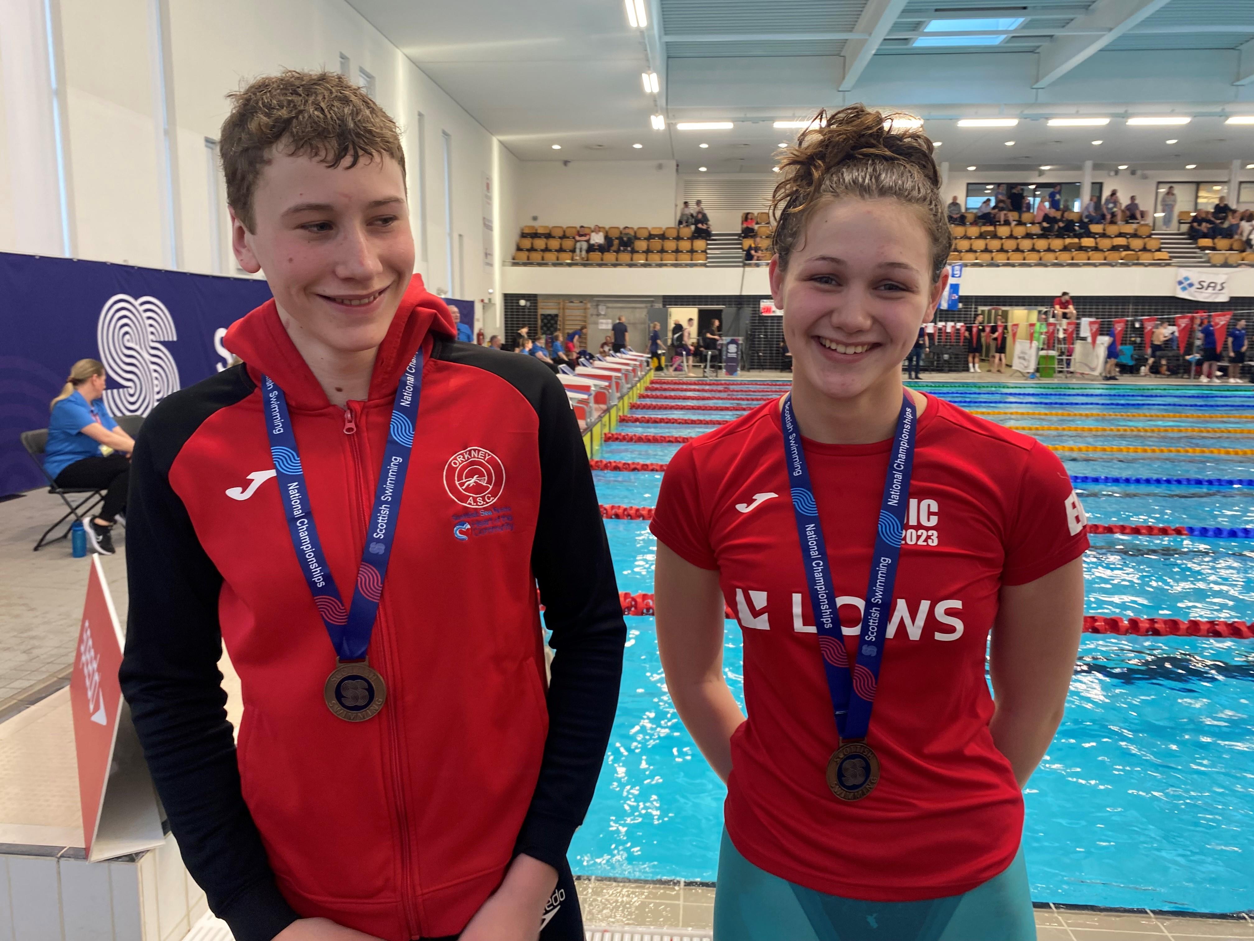 Record-breaking swimming duo strike gold!